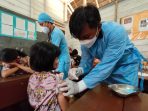 Pelaksanaan vaksinasi bagi anak usia 6-11 tahun dan lansia yang dilakukan oleh TNI-Polri. Foto : HO.