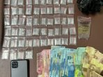 Barang bukti yang ditemukan petugas saat melakukan penggeledahan. Foto:BorneoFlash.com/Ist.