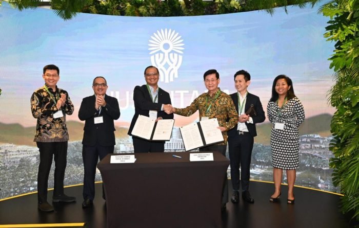 OIKN menandatangani Non Disclosure Agreement (NDA) dengan State Power Investment Corporation (SPIC) dan JOE Green Pte Ltd. pada agenda Ecosperity Week 2023, di Marina Bay Sands Expo and Convention Hall, Singapura, Kamis (8/6/2023). Foto: BorneoFlash.com/Ist.