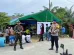 TNI dan Polri menjaga keamanan TPS di Kabupaten Penajam Paser Utara (PPU), Rabu (14/2/2024). Foto: HO/Humas Polda Kaltim.