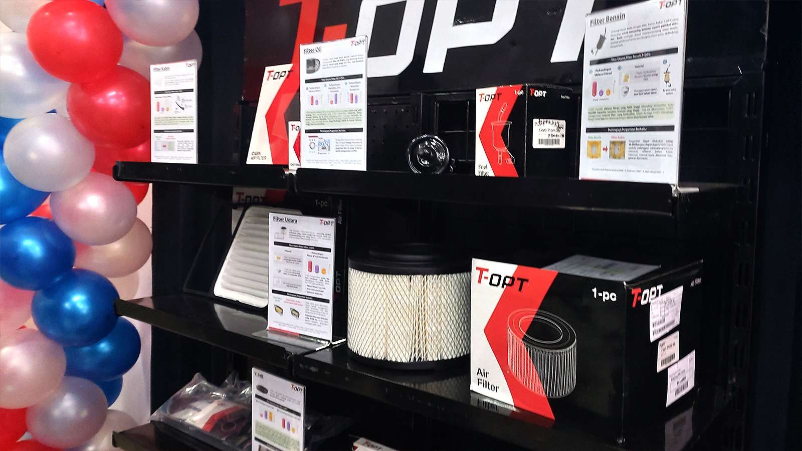 Spare part brand T-OPT yang tersedia di OtoXpert Balikpapan, termasuk filter udara, kampas rem depan, kampas rem belakang, filter kabin, filter oli, wiper blade, V-belt, dan filter bensin.