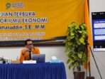 Direktur Utama Perumda Tirta Manuntung Balikpapan (PTMB), Dr. Saharuddin saat mengikuti sidang promosi Doktor di Universitas Mulawarman, pada hari ini Kamis (5/12/2024). Foto: BorneoFlash/Ist