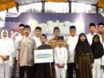 PTMB saat memberikan bantuan kepada ratusan anak yatim piatu saat buka puasa bersama di Halaman Kantor PTMB, pada hari Senin (10/3/2025). Foto: BorneoFlash/Niken Sulastri