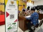 Para ASN di lingkungan Pemkot Balikpapan Melakukan Pembayaran zakat fitrah melalui Baznas Kota Balikpapan, yang berlangsung di Auditorium Balai Kota Balikpapan, pada hari Senin (17/3/2025). Foto: BorneoFlash/Niken Sulastri