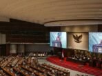 Layar menampilkan Menteri Keuangan (Menkeu) Sri Mulyani Indrawati menyampaikan tanggapan Pemerintah pada Rapat Paripurna DPR ke-3 masa Persidangan I Tahun Sidang 2025-2026, di Kompleks Parlemen, Senayan, Jakarta, Kamis (21/8/2025). FOTO : ANTARA FOTO/Asprilla Dwi Adha/YU.