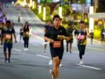Para peserta Qubika Nusantara Glow Run 7K 2025 memeriahkan running event sejauh 7 kilometer di wilayah Nusantara saat malam hari. Foto: HO/Humas Otorita IKN